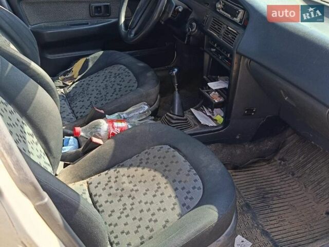 Белый Тойота Королла, объемом двигателя 1.8 л и пробегом 300 тыс. км за 600 $, фото 1 на Automoto.ua