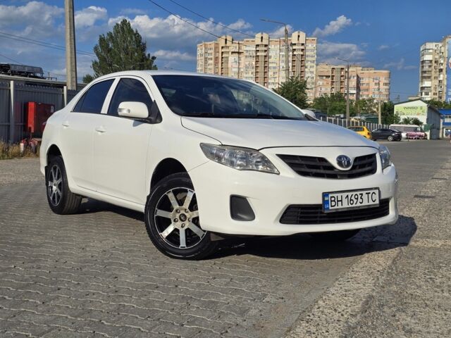 Білий Тойота Королла, об'ємом двигуна 1.3 л та пробігом 215 тис. км за 6037 $, фото 1 на Automoto.ua