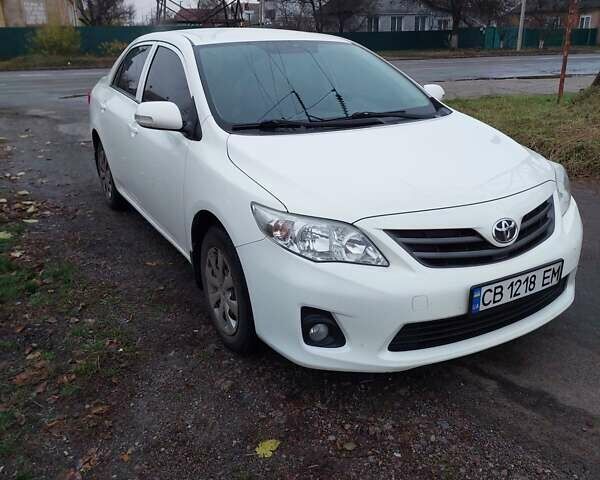 Білий Тойота Королла, об'ємом двигуна 1.33 л та пробігом 96 тис. км за 9800 $, фото 1 на Automoto.ua