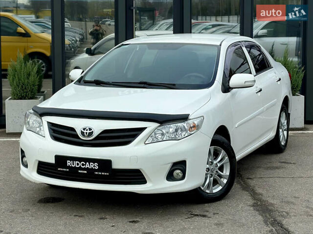 Білий Тойота Королла, об'ємом двигуна 1.33 л та пробігом 243 тис. км за 7399 $, фото 1 на Automoto.ua