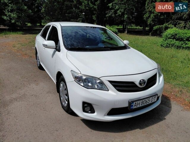 Белый Тойота Королла, объемом двигателя 1.33 л и пробегом 226 тыс. км за 8500 $, фото 1 на Automoto.ua
