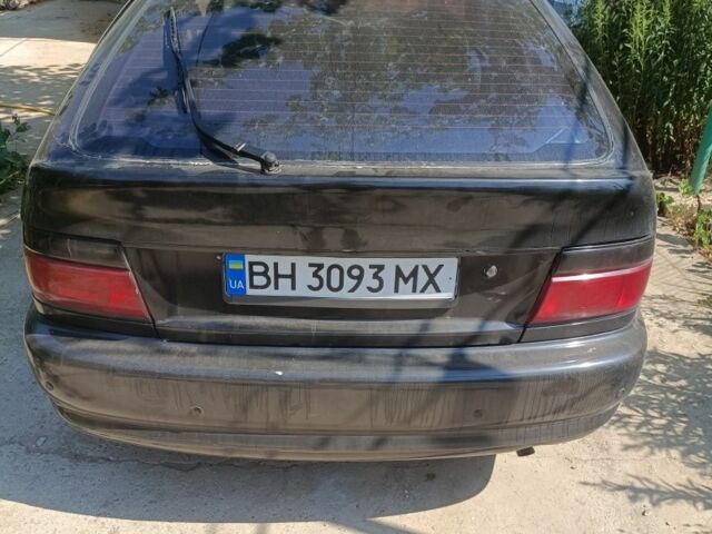 Черный Тойота Королла, объемом двигателя 1.6 л и пробегом 380 тыс. км за 700 $, фото 1 на Automoto.ua