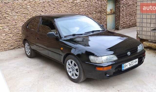 Черный Тойота Королла, объемом двигателя 1.3 л и пробегом 460 тыс. км за 2200 $, фото 1 на Automoto.ua