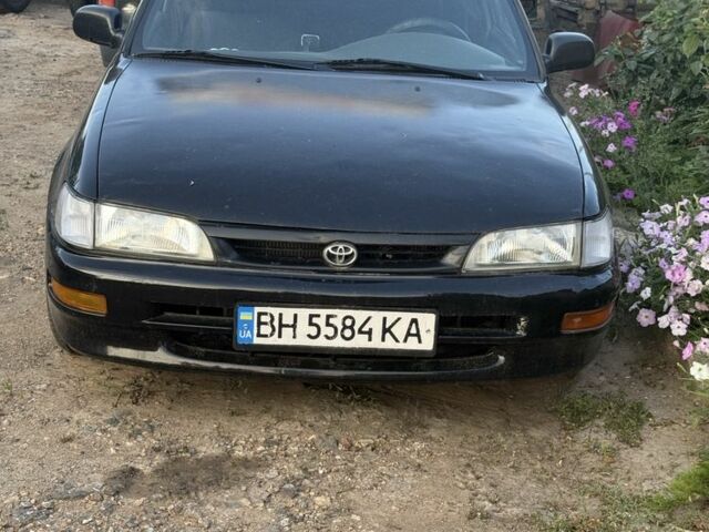 Черный Тойота Королла, объемом двигателя 1.3 л и пробегом 400 тыс. км за 1400 $, фото 1 на Automoto.ua