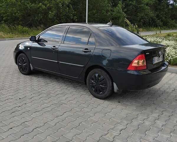 Чорний Тойота Королла, об'ємом двигуна 1.6 л та пробігом 230 тис. км за 4999 $, фото 1 на Automoto.ua