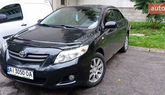 Черный Тойота Королла, объемом двигателя 1.6 л и пробегом 300 тыс. км за 7200 $, фото 1 на Automoto.ua