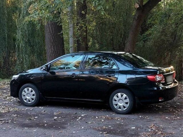Черный Тойота Королла, объемом двигателя 1.3 л и пробегом 115 тыс. км за 5499 $, фото 1 на Automoto.ua