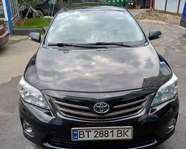 Черный Тойота Королла, объемом двигателя 1.3 л и пробегом 167 тыс. км за 9000 $, фото 1 на Automoto.ua