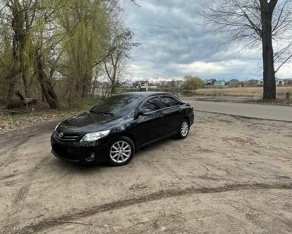 Чорний Тойота Королла, об'ємом двигуна 1.6 л та пробігом 169 тис. км за 11600 $, фото 1 на Automoto.ua