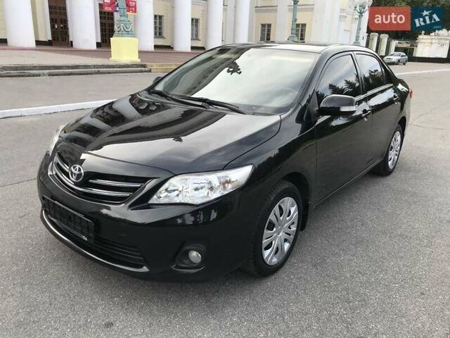 Чорний Тойота Королла, об'ємом двигуна 1.6 л та пробігом 165 тис. км за 10799 $, фото 1 на Automoto.ua
