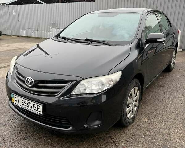 Чорний Тойота Королла, об'ємом двигуна 1.3 л та пробігом 175 тис. км за 7955 $, фото 1 на Automoto.ua