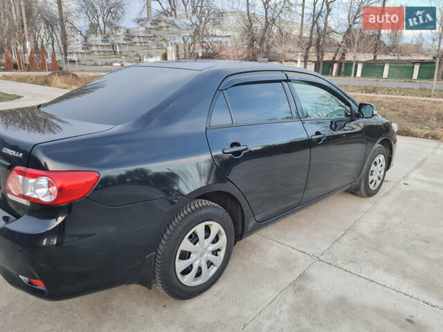 Черный Тойота Королла, объемом двигателя 1.33 л и пробегом 141 тыс. км за 9200 $, фото 1 на Automoto.ua