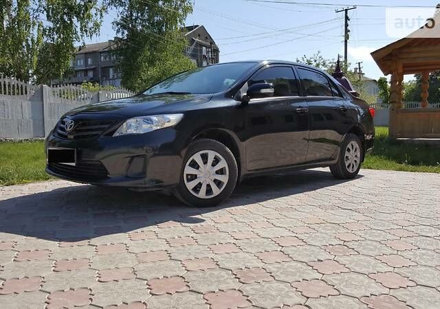 Чорний Тойота Королла, об'ємом двигуна 1.33 л та пробігом 120 тис. км за 9300 $, фото 1 на Automoto.ua