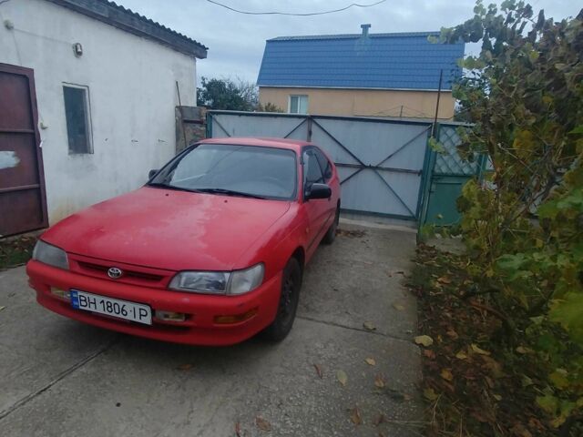 Червоний Тойота Королла, об'ємом двигуна 1.3 л та пробігом 289 тис. км за 2100 $, фото 1 на Automoto.ua