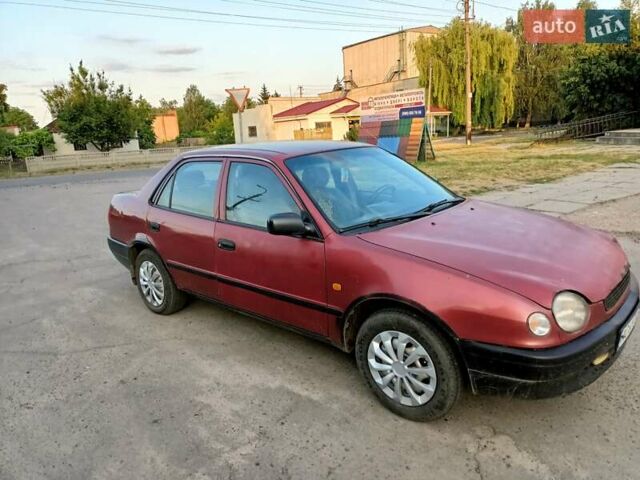 Червоний Тойота Королла, об'ємом двигуна 1.4 л та пробігом 270 тис. км за 1300 $, фото 1 на Automoto.ua