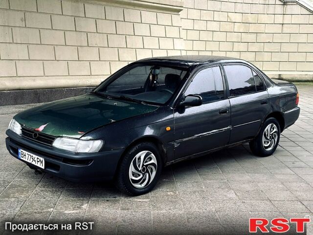 Серый Тойота Королла, объемом двигателя 1.3 л и пробегом 355 тыс. км за 1400 $, фото 1 на Automoto.ua