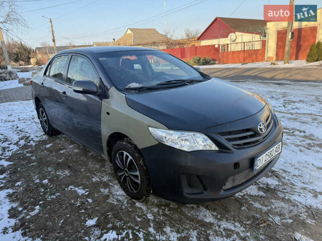 Серый Тойота Королла, объемом двигателя 1.33 л и пробегом 250 тыс. км за 3850 $, фото 1 на Automoto.ua