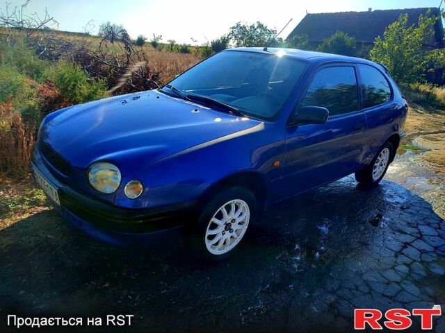 Синій Тойота Королла, об'ємом двигуна 1.3 л та пробігом 242 тис. км за 3200 $, фото 1 на Automoto.ua