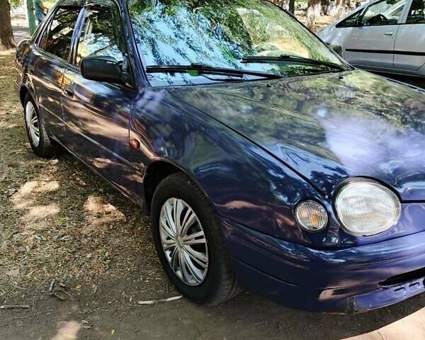 Синий Тойота Королла, объемом двигателя 1.3 л и пробегом 324 тыс. км за 2300 $, фото 1 на Automoto.ua