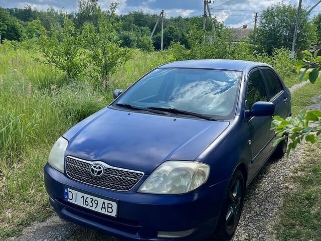 Синий Тойота Королла, объемом двигателя 1.4 л и пробегом 230 тыс. км за 3100 $, фото 1 на Automoto.ua