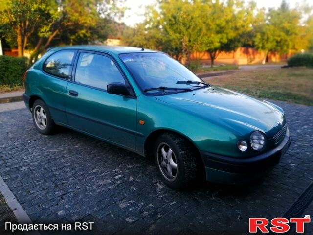 Зелений Тойота Королла, об'ємом двигуна 1.3 л та пробігом 215 тис. км за 1850 $, фото 1 на Automoto.ua