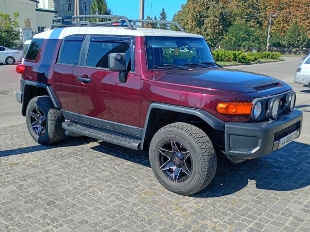 Красный Тойота ФЖ Крузер, объемом двигателя 4 л и пробегом 245 тыс. км за 19500 $, фото 1 на Automoto.ua