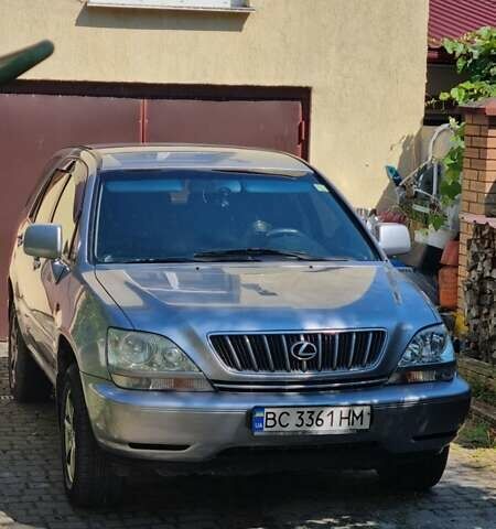 Сірий Тойота Харріер, об'ємом двигуна 3 л та пробігом 243 тис. км за 9500 $, фото 1 на Automoto.ua