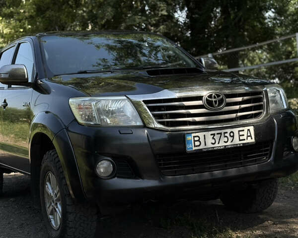 Чорний Тойота Хайлюкс, об'ємом двигуна 2.49 л та пробігом 377 тис. км за 12100 $, фото 1 на Automoto.ua