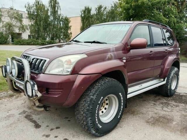 Красный Тойота Ленд Крузер 100, объемом двигателя 3 л и пробегом 240 тыс. км за 3121 $, фото 1 на Automoto.ua