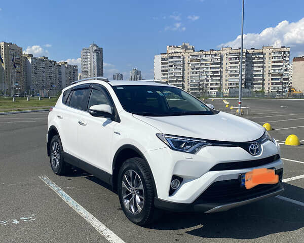 Белый Тойота РАВ 4, объемом двигателя 2.5 л и пробегом 195 тыс. км за 23000 $, фото 1 на Automoto.ua