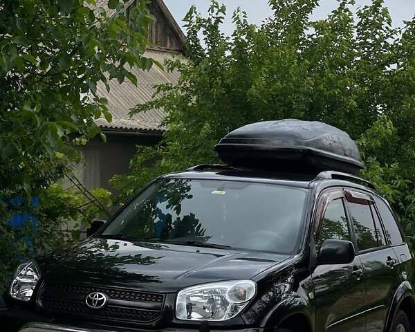Чорний Тойота РАВ 4, об'ємом двигуна 2 л та пробігом 265 тис. км за 6699 $, фото 1 на Automoto.ua