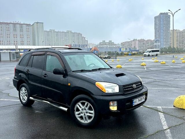 Черный Тойота РАВ 4, объемом двигателя 2 л и пробегом 225 тыс. км за 6350 $, фото 1 на Automoto.ua