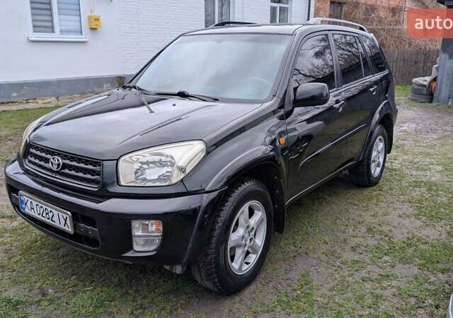 Черный Тойота РАВ 4, объемом двигателя 2 л и пробегом 406 тыс. км за 6000 $, фото 1 на Automoto.ua