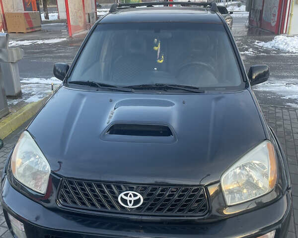 Черный Тойота РАВ 4, объемом двигателя 2 л и пробегом 217 тыс. км за 5800 $, фото 1 на Automoto.ua