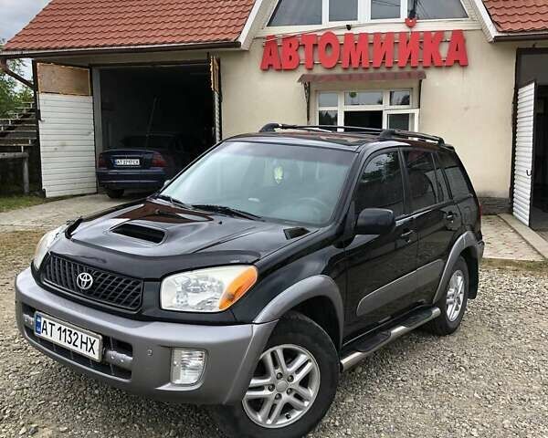 Чорний Тойота РАВ 4, об'ємом двигуна 2 л та пробігом 160 тис. км за 7000 $, фото 1 на Automoto.ua