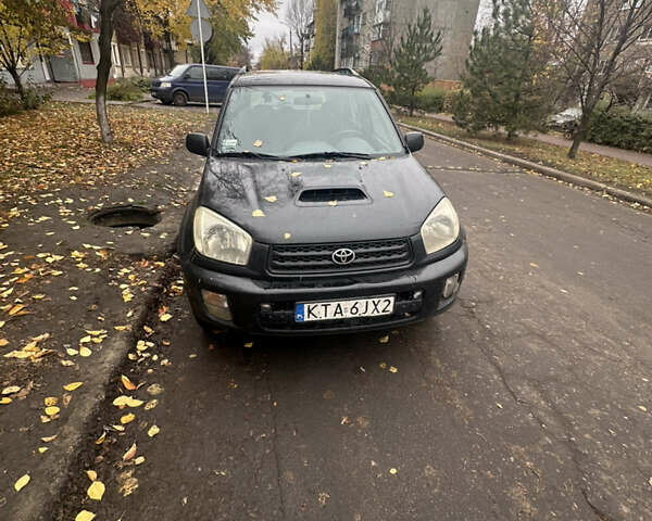 Черный Тойота РАВ 4, объемом двигателя 2 л и пробегом 395 тыс. км за 4200 $, фото 1 на Automoto.ua