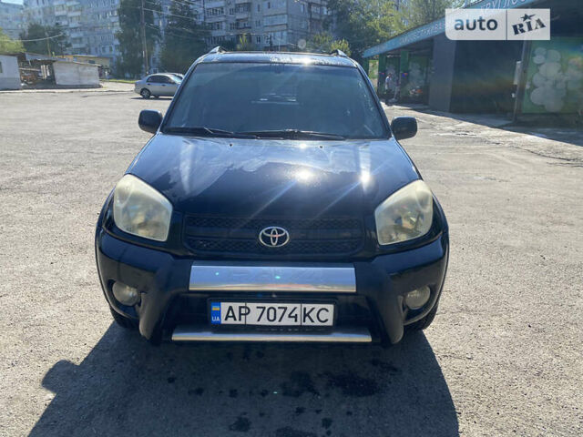 Черный Тойота РАВ 4, объемом двигателя 2 л и пробегом 262 тыс. км за 8800 $, фото 1 на Automoto.ua