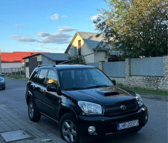 Черный Тойота РАВ 4, объемом двигателя 2 л и пробегом 350 тыс. км за 4500 $, фото 1 на Automoto.ua