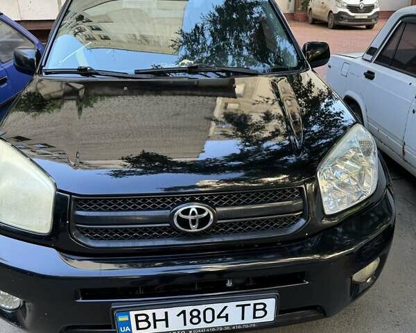 Черный Тойота РАВ 4, объемом двигателя 2 л и пробегом 279 тыс. км за 7000 $, фото 1 на Automoto.ua