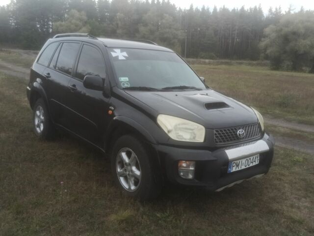 Чорний Тойота РАВ 4, об'ємом двигуна 2 л та пробігом 300 тис. км за 3500 $, фото 1 на Automoto.ua
