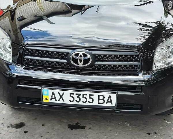Чорний Тойота РАВ 4, об'ємом двигуна 2.4 л та пробігом 91 тис. км за 12500 $, фото 1 на Automoto.ua