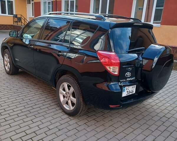Черный Тойота РАВ 4, объемом двигателя 2.36 л и пробегом 200 тыс. км за 9000 $, фото 1 на Automoto.ua