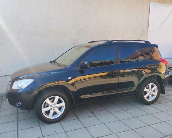 Чорний Тойота РАВ 4, об'ємом двигуна 2 л та пробігом 170 тис. км за 11500 $, фото 1 на Automoto.ua