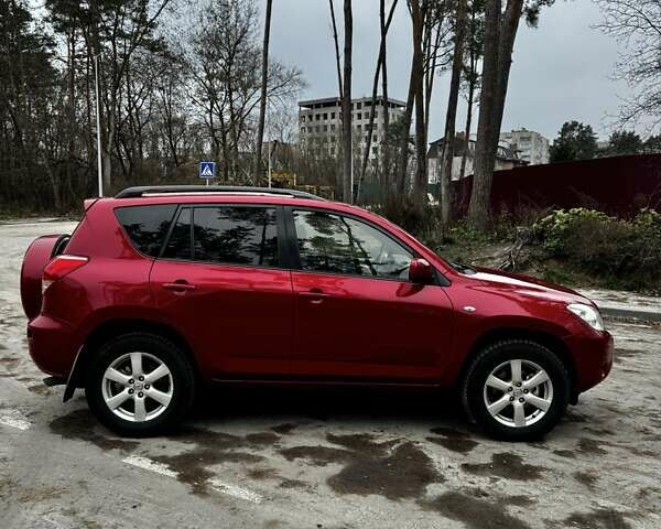 Червоний Тойота РАВ 4, об'ємом двигуна 2 л та пробігом 131 тис. км за 12999 $, фото 1 на Automoto.ua