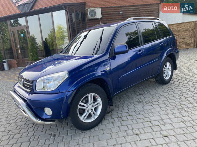 Синій Тойота РАВ 4, об'ємом двигуна 2 л та пробігом 235 тис. км за 6900 $, фото 1 на Automoto.ua