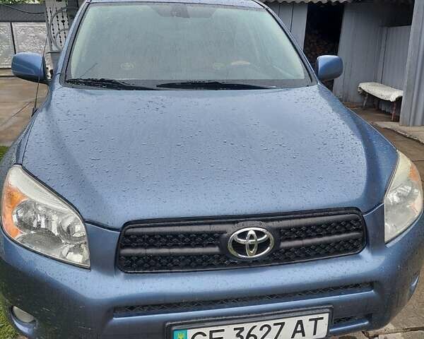 Синий Тойота РАВ 4, объемом двигателя 2.36 л и пробегом 102 тыс. км за 10000 $, фото 1 на Automoto.ua