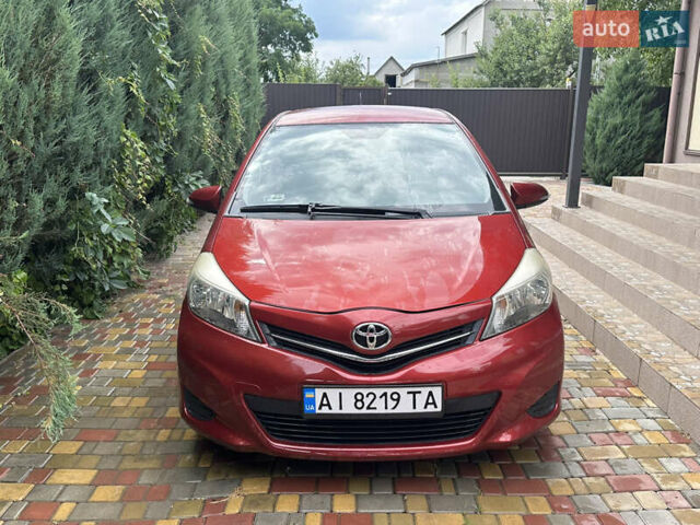 Красный Тойота Ярис, объемом двигателя 1.33 л и пробегом 129 тыс. км за 7300 $, фото 1 на Automoto.ua