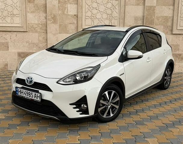 Білий Тойота Aqua, об'ємом двигуна 1.5 л та пробігом 79 тис. км за 14400 $, фото 1 на Automoto.ua