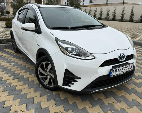 Белый Тойота Aqua, объемом двигателя 1.5 л и пробегом 91 тыс. км за 13400 $, фото 1 на Automoto.ua