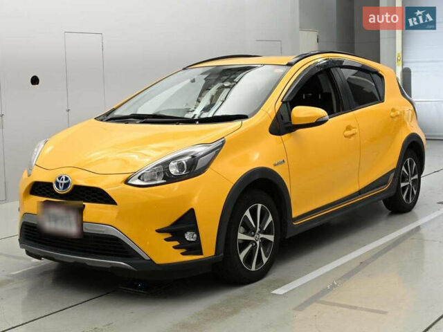 Желтый Тойота Aqua, объемом двигателя 1.5 л и пробегом 102 тыс. км за 12800 $, фото 1 на Automoto.ua